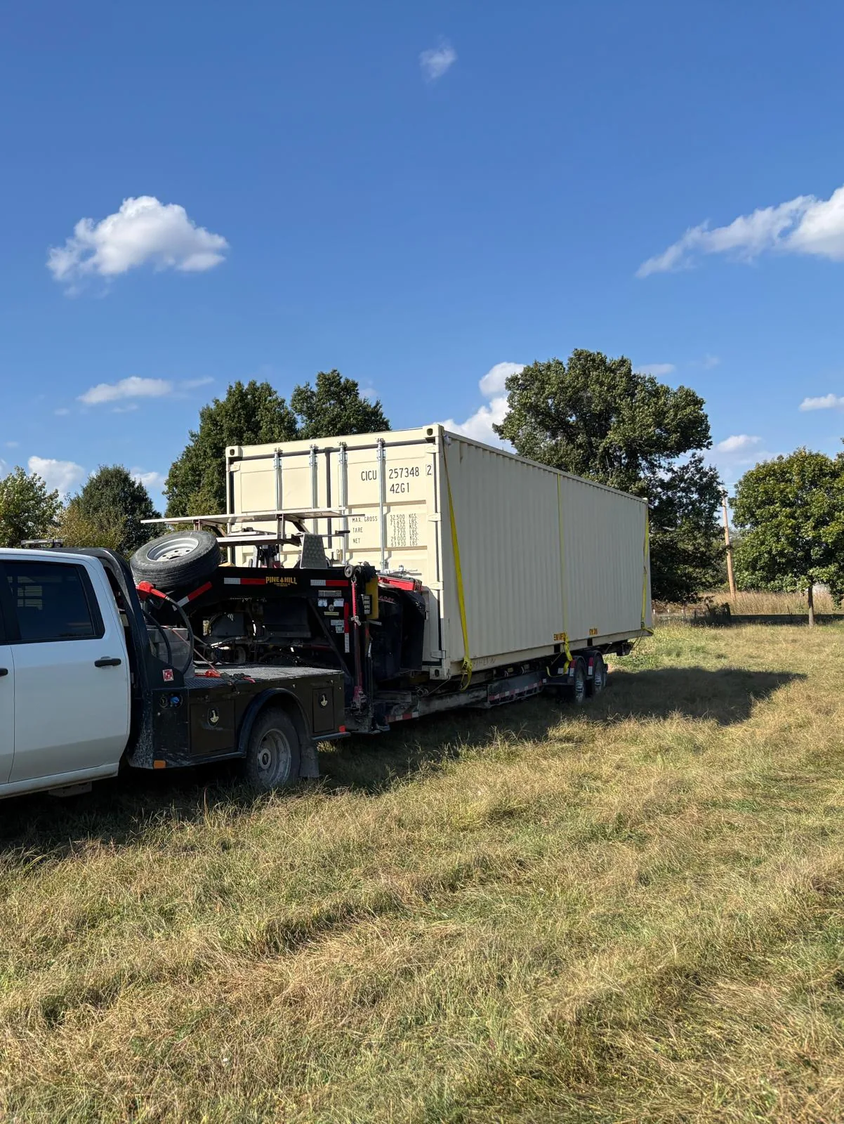 Shipping container on specialized trailer
