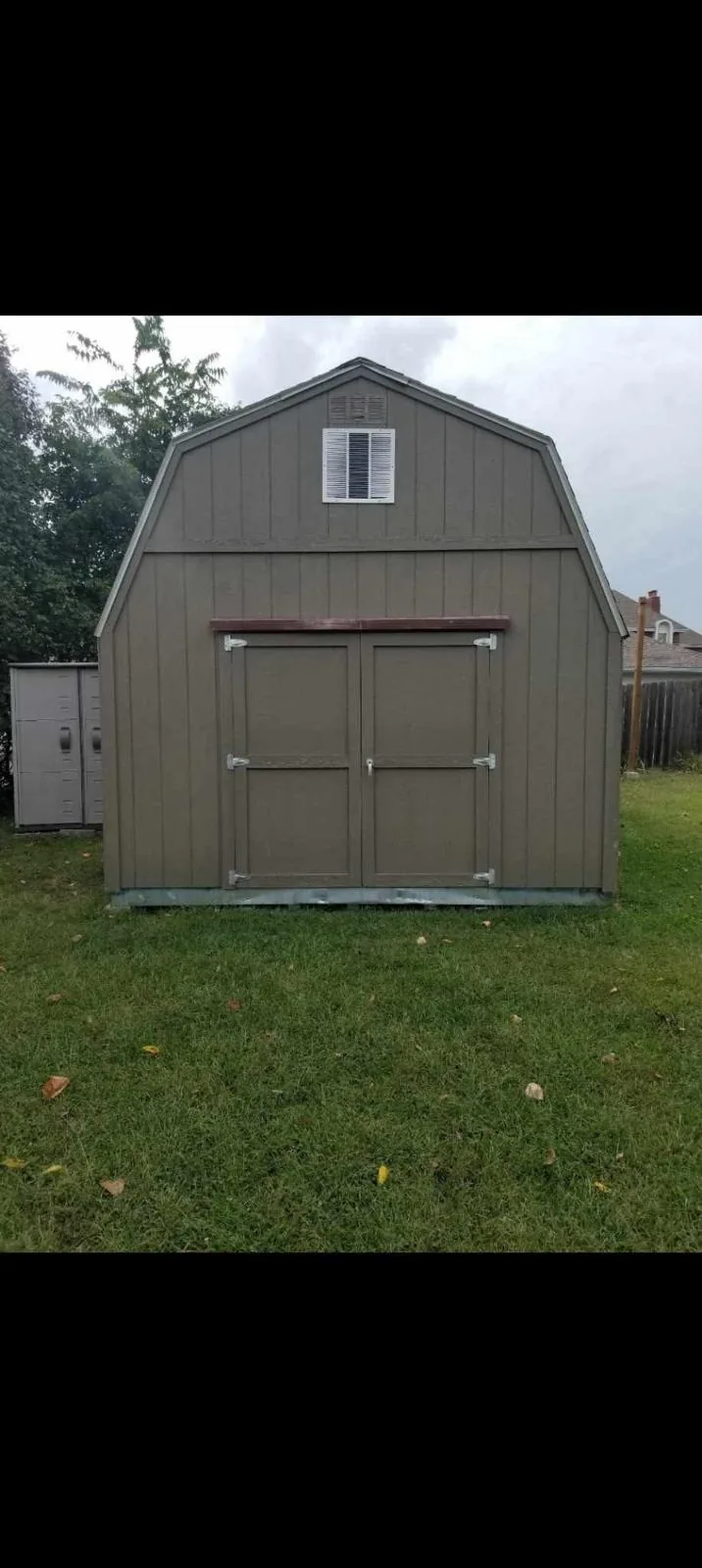 Front view of a barn style storage shed