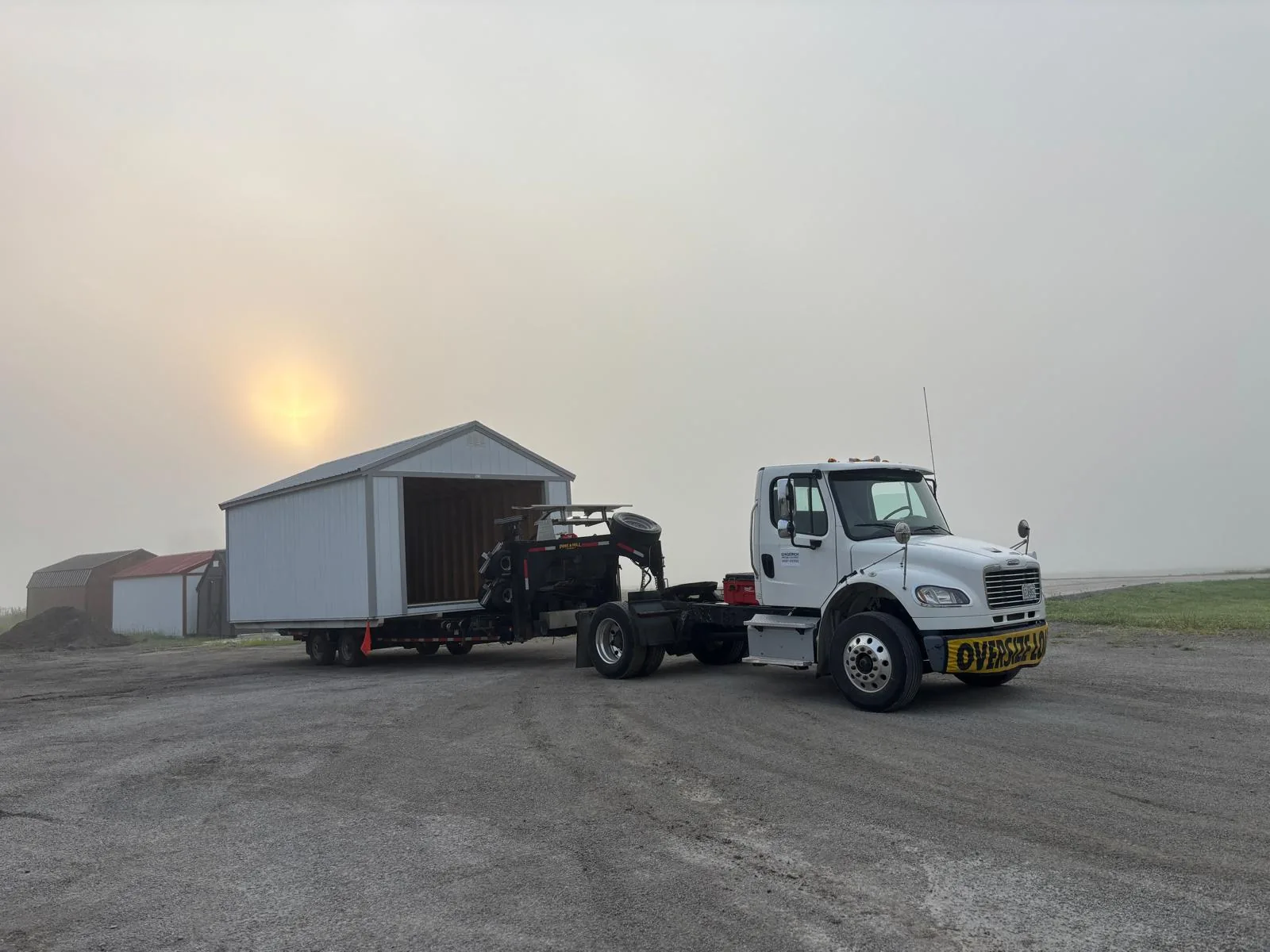 River Bend Transport truck hauling a portable garage