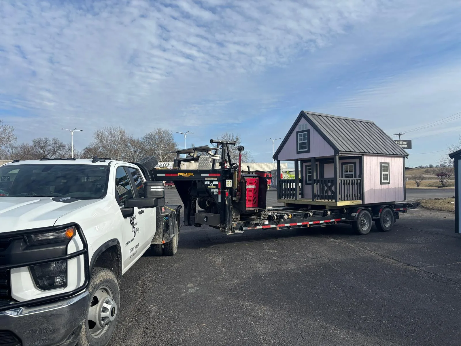 Playhouse secured on transport trailer